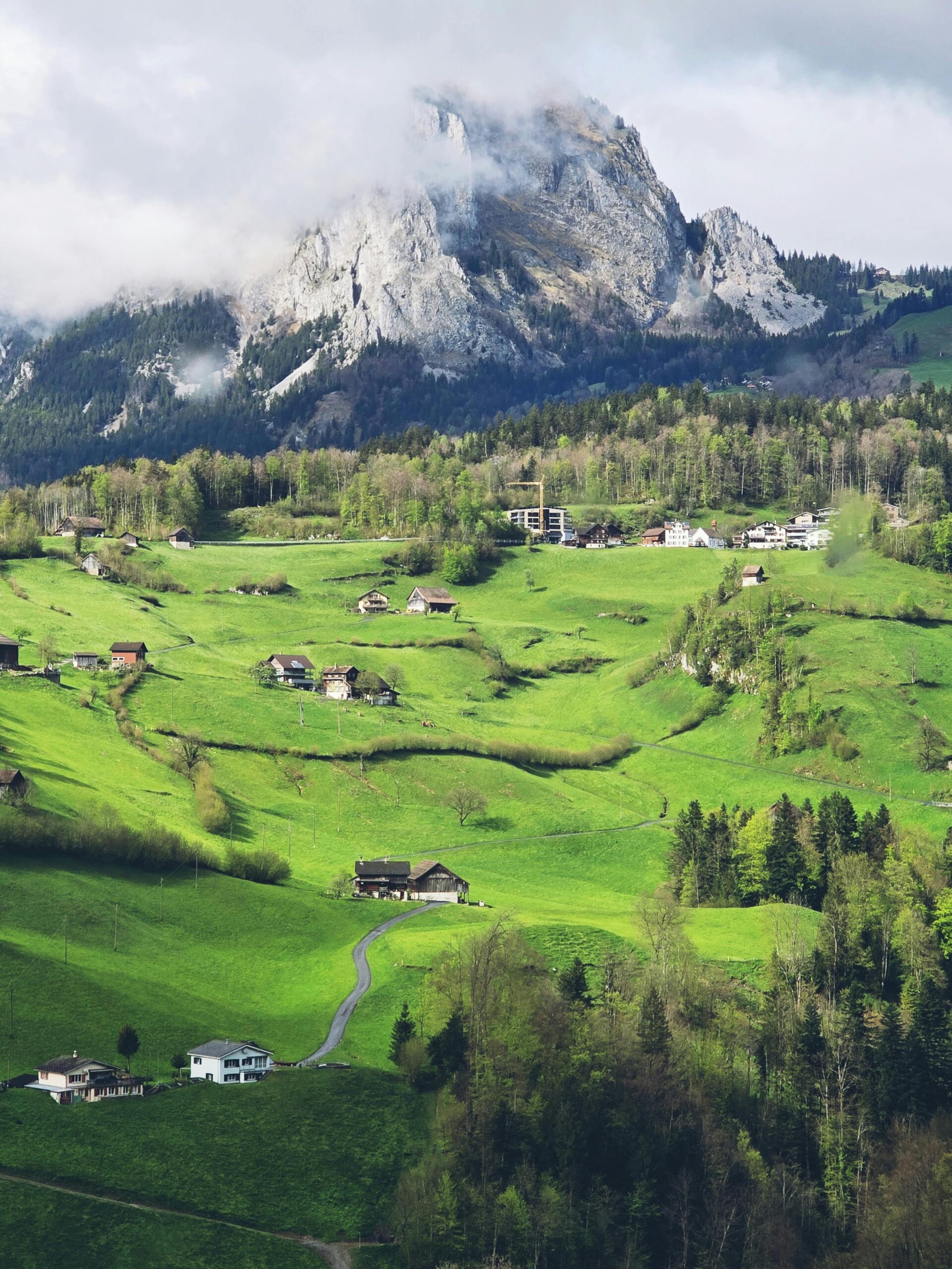 Explore the lush, rolling hills of Morschach, Switzerland, with stunning views of the Swiss Alps.